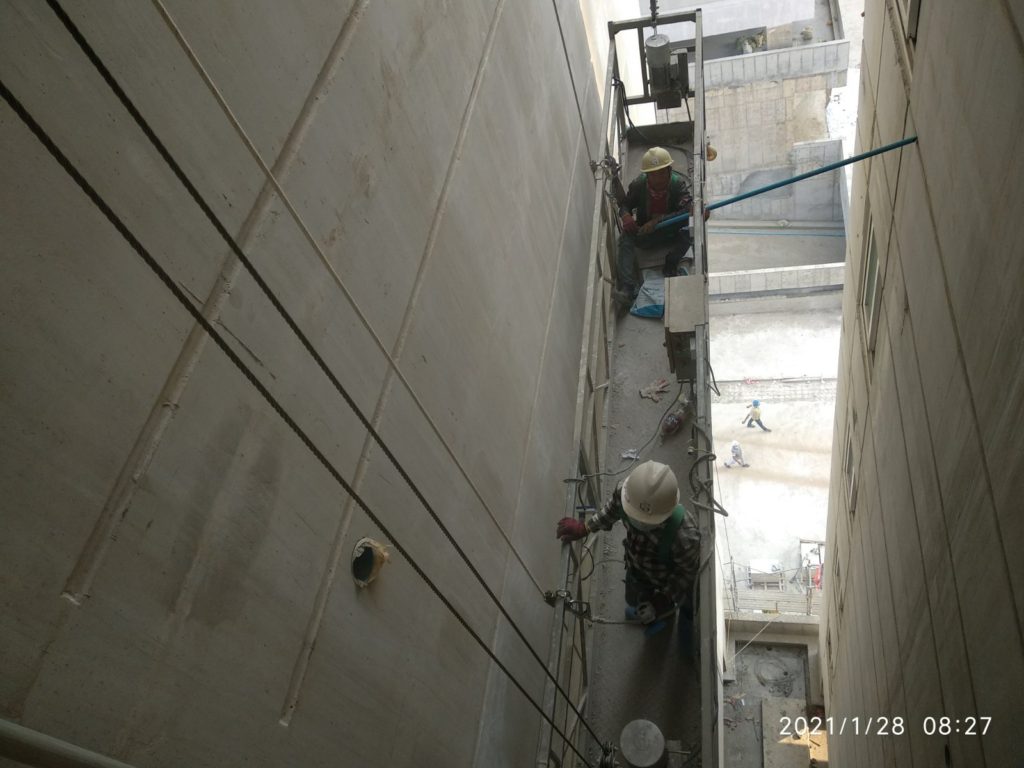 block-101-surface-treatment-working-at-east-side-ls-worker